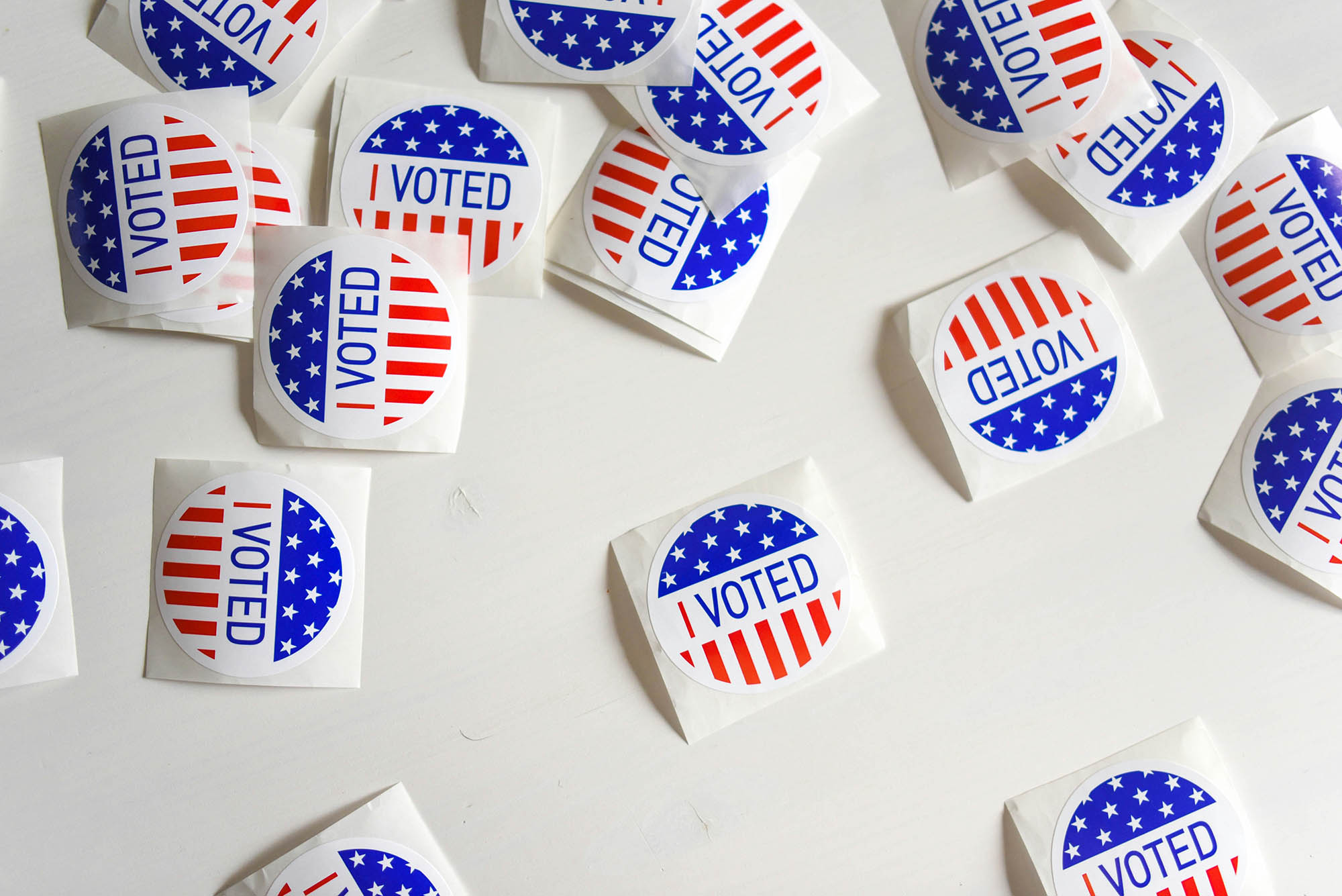 Photo: An overlay shot of various I VOTED stickers.
