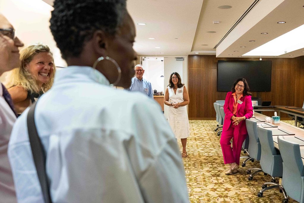 Photo: BU President Melissa L. Gilliam and a group of people in a conference room
