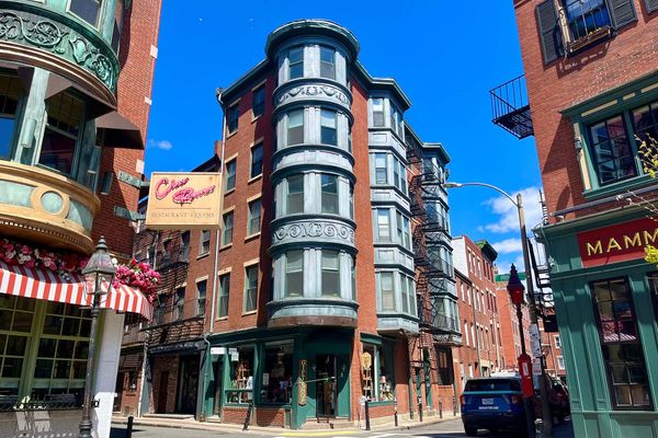 Photo: A bustling square in Boston's North End, surrounded by brick buildings