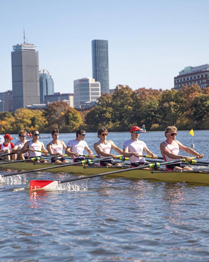 Boston University Student George Kreidler (Questrom'27) and his fellow crew rowing across the Charles River. 