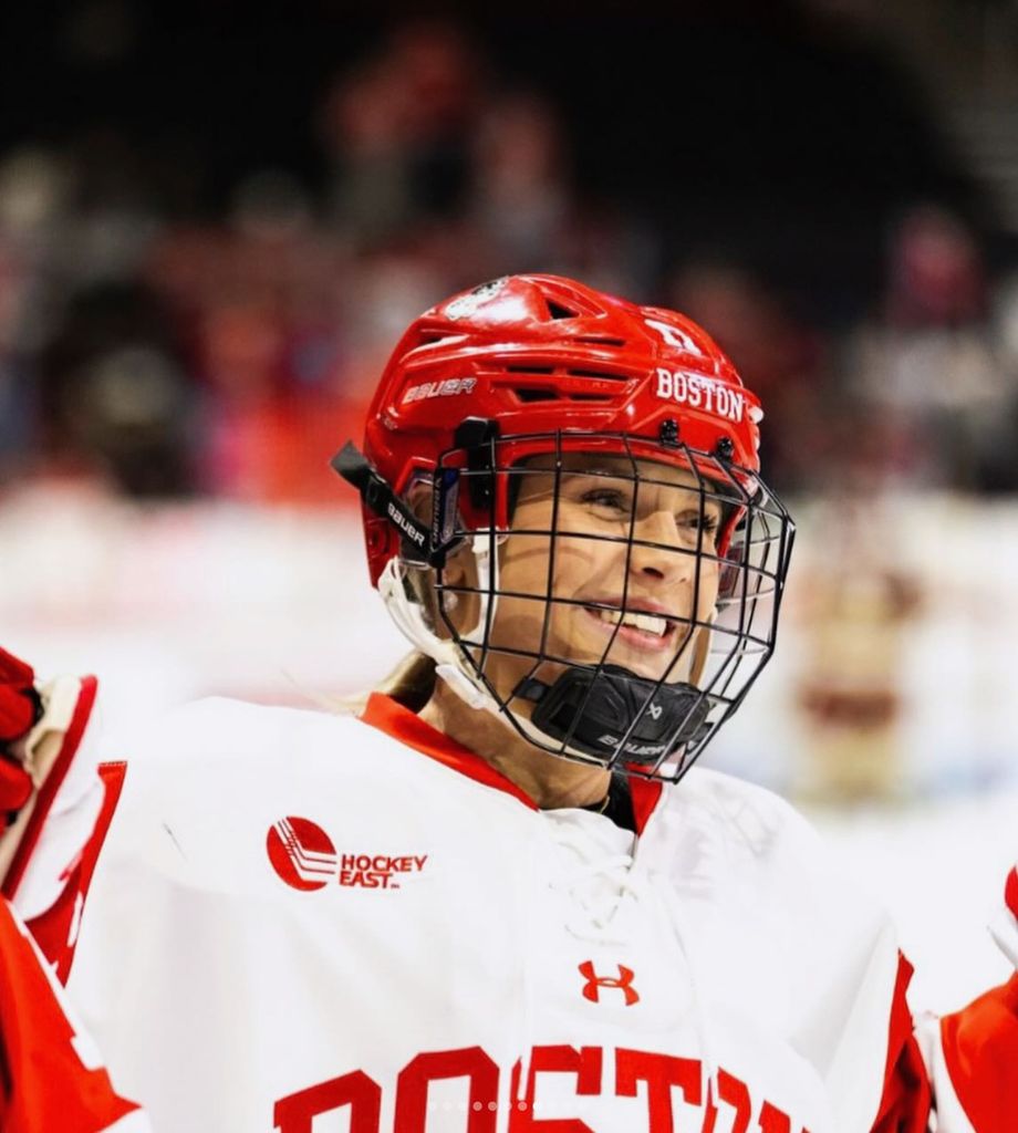 Boston University student Alex Law (COM'27) in her hockey uniform. 