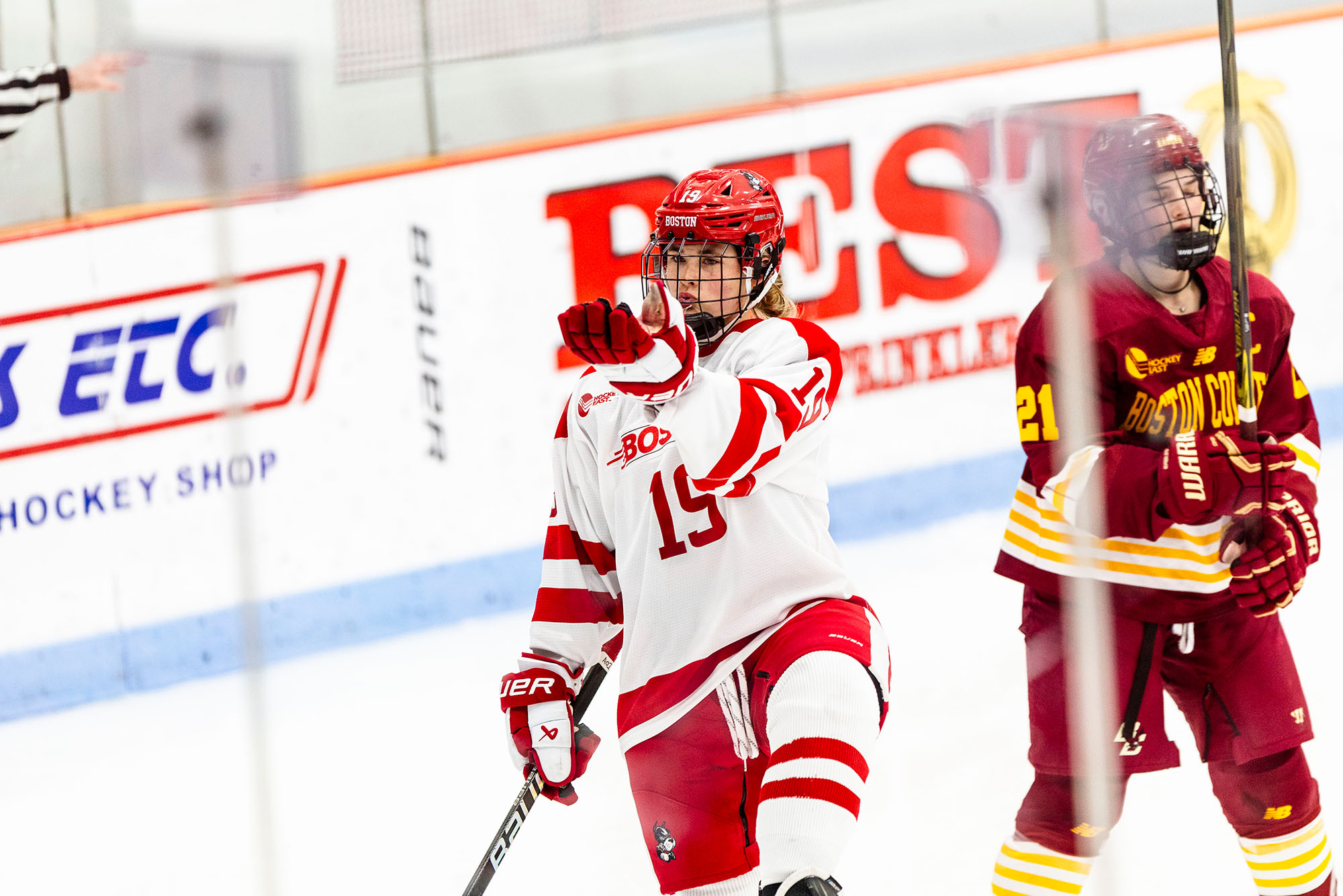 Photo: A female hockey player celebrating a goal on the ice