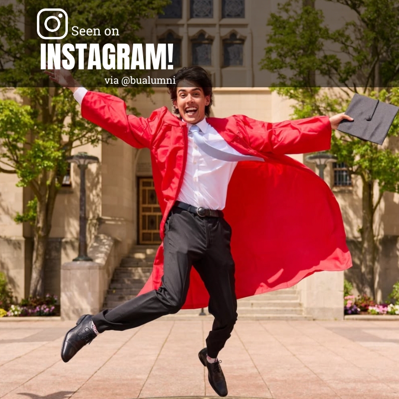 Photo: A young man in graduation regalia jumping to celebrate graduating.
