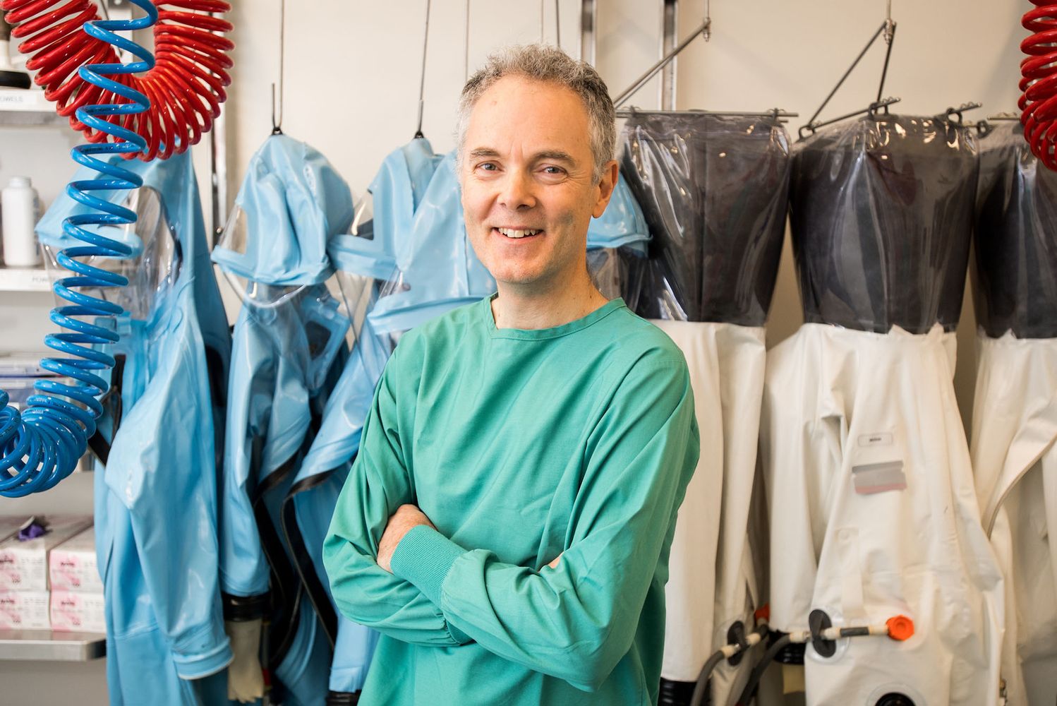 Photo: Robert Davey poses for a portrait in his BU lab