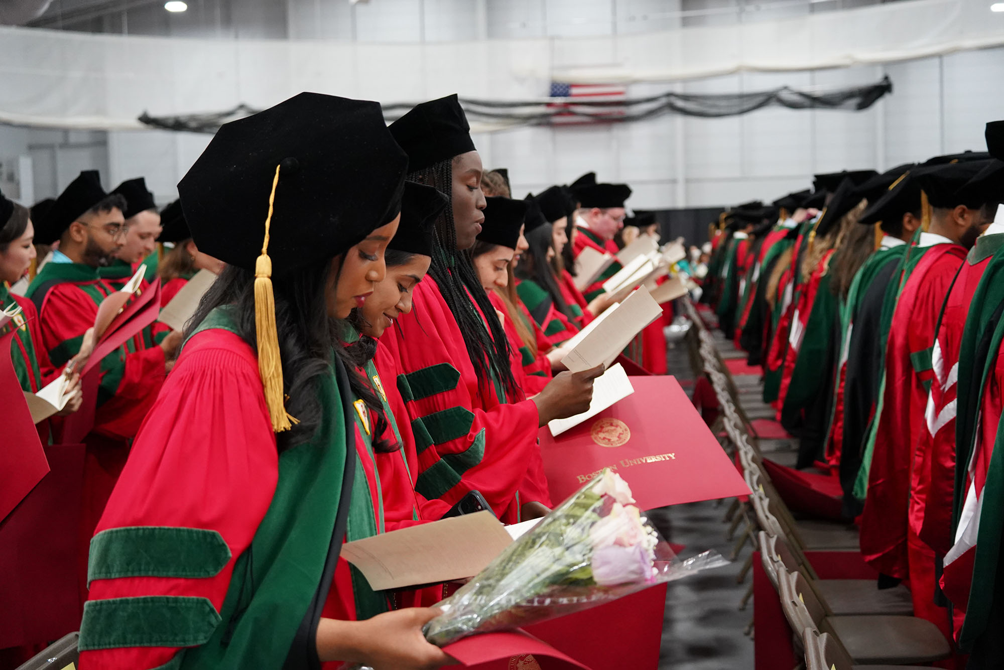 Photo: Newly-minted MDs recite the Hippocratic Oath during their convocation ceremony May 15. Photos by Jake Mackey