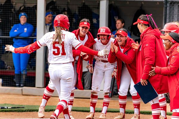 Kylie Doherty (CAS’27) is greeted by her teammates at home plate after hitting a home run against Kentucky at BU Softball Field, April 11. The Terriers own the most potent offense in the conference, which will be key in this weekend’s tournament. Photo by Nate Adams/BU Athletics