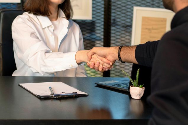 Photo: Stock image of two people shaking hands in mock interview.