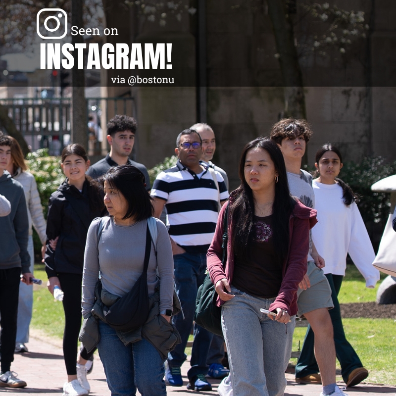 Photo: A candid image of college kids walking on campus on a sunny day.