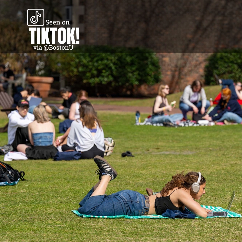 Photo: BU students loungin on green space. Text overlay reads "Seen on TikTok! via @BostonU"