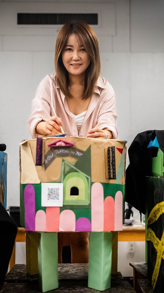 Photo: Jieun Lim (CFA’26), a master in arts education student, poses with some of her educational materials