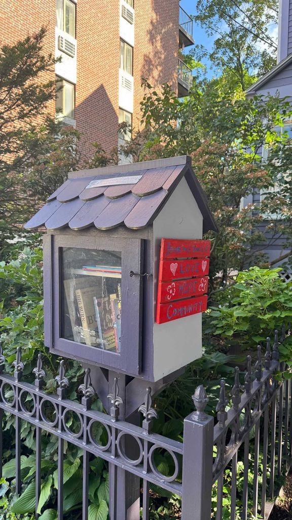 Photo: A little home with boxes inside: a free little library for the community.