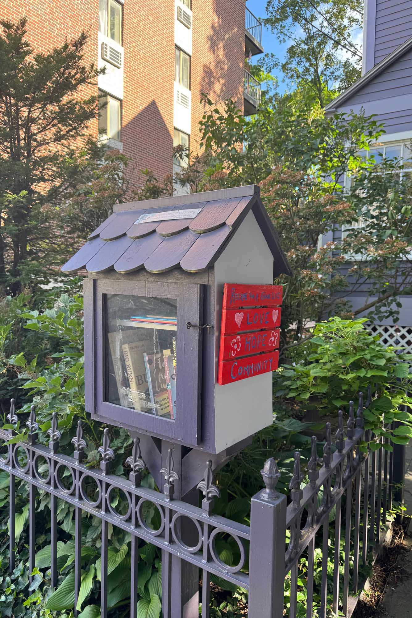 Photo: A little home with boxes inside: a free little library for the community.
