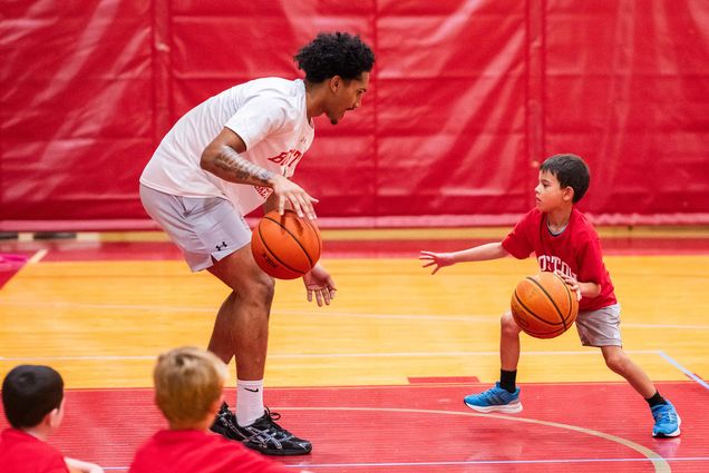 Photo: Donte Tisinger (CAS 29) plays a basetball game during a sports camp on July 23,2025.
