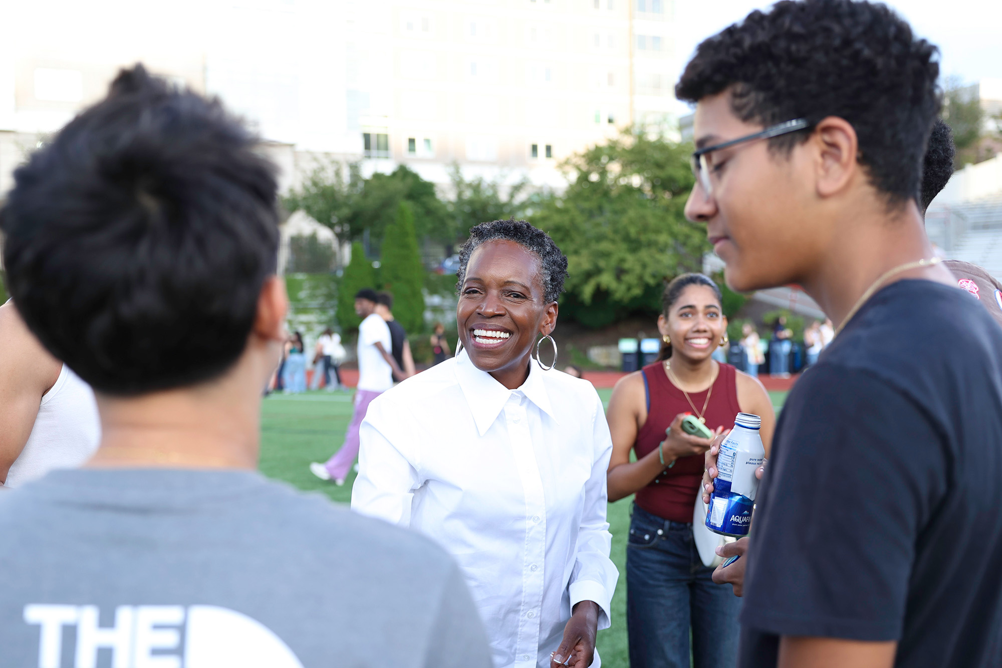 Photo: BU President Melissa Gilliam greeting students at a Welcome BBQ
