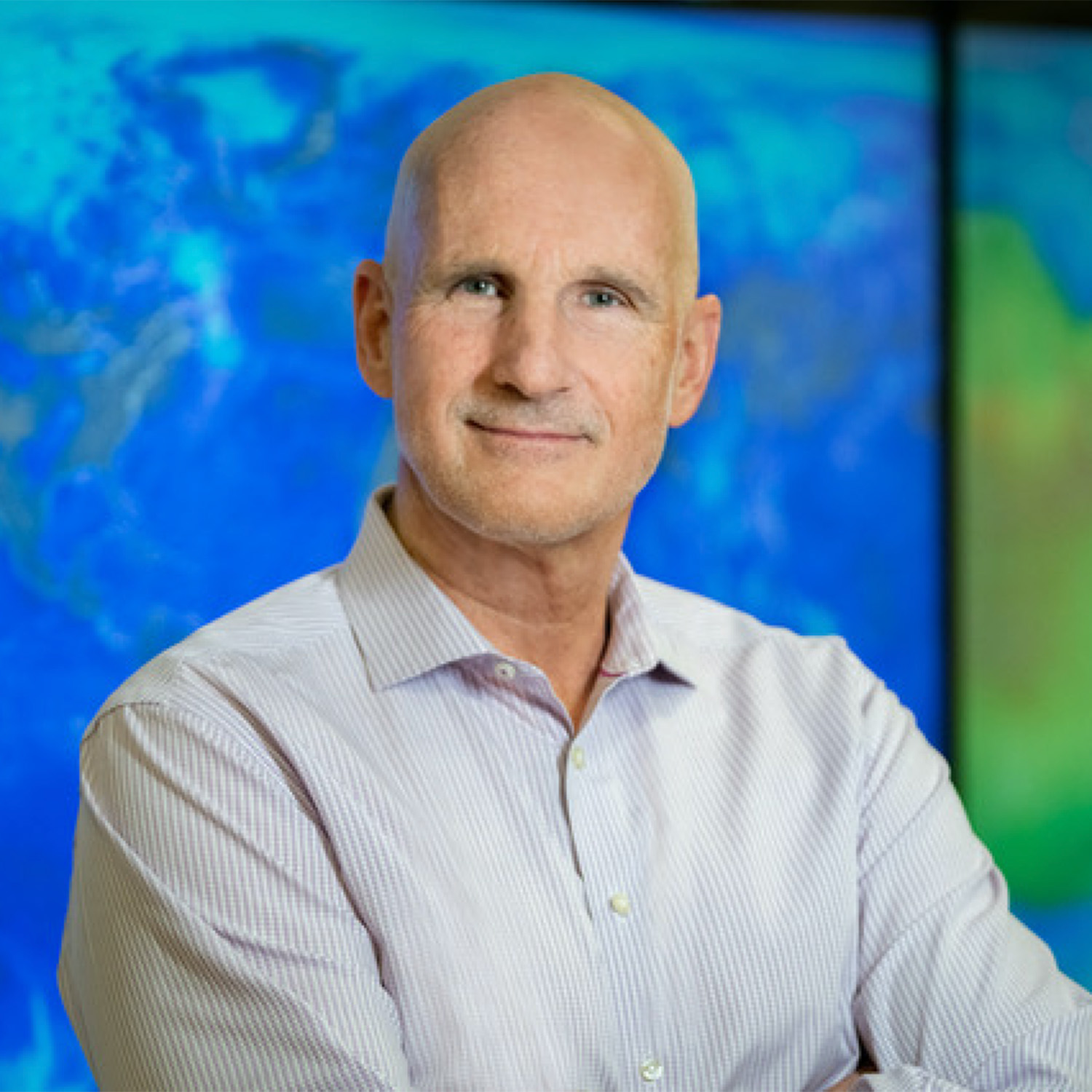 Photo: Cutler cleveland, a professor at BU, posing in a dress shirt for a headshot