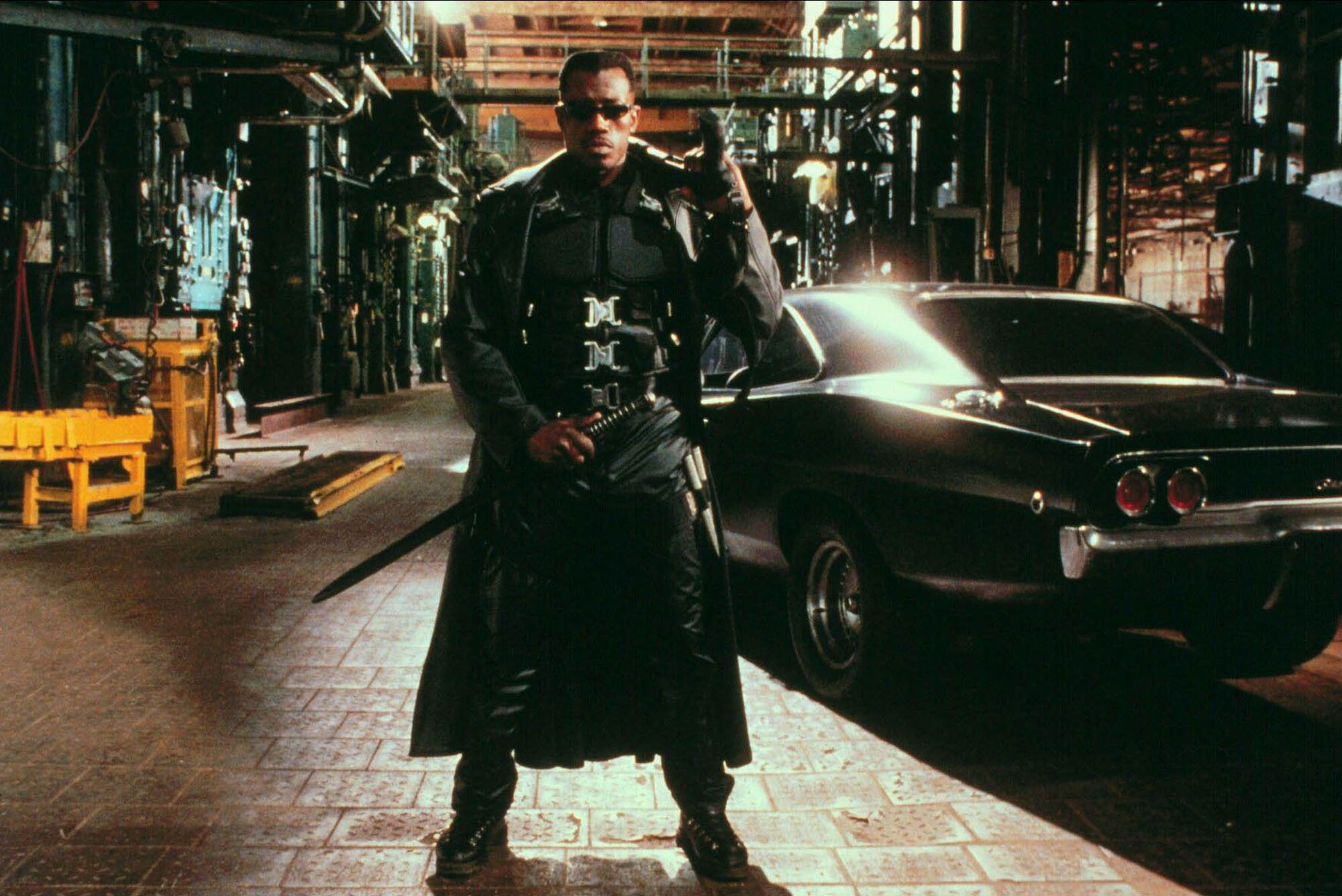 Photo: A still from Blade with the character Blade standing in the middle of the sidewalk.