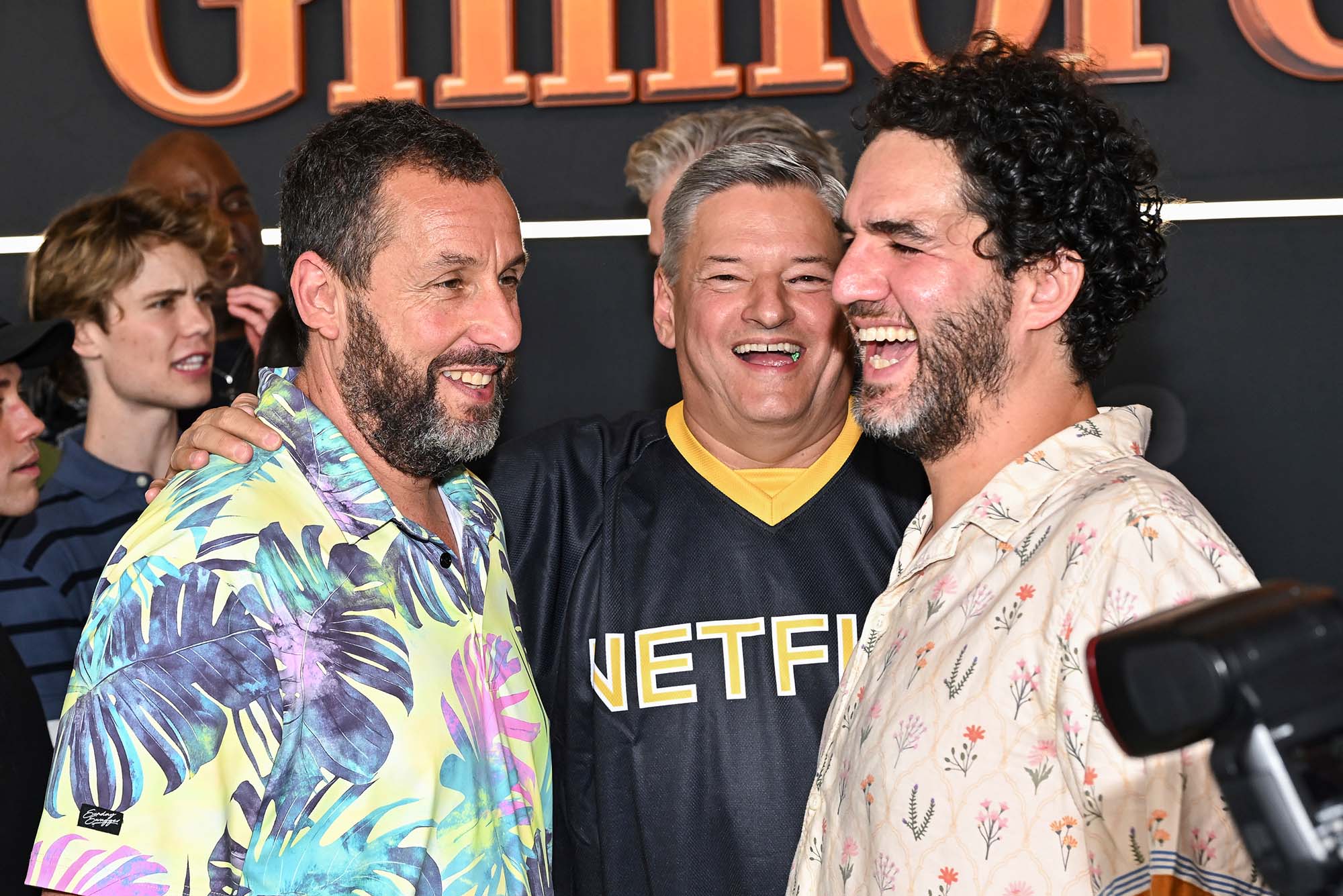 Adam Sandler, left, Ted Sarandos, and BU alum Benny Safdie attend the premiere of Netflix’s “Happy Gilmore 2” on Monday, July 21, 2025, in New York. Photo by Evan Agostini/Invision/AP