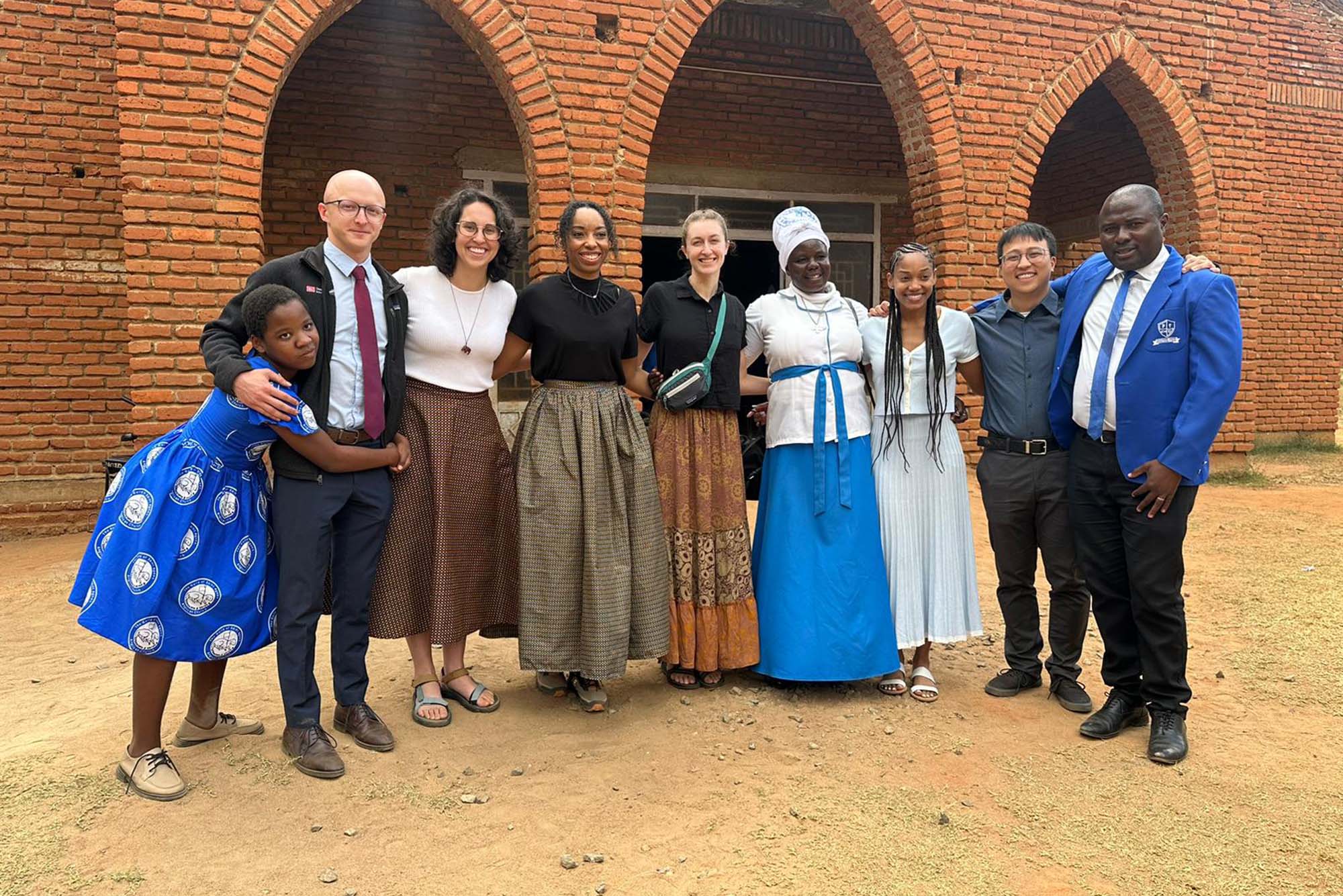 Boston University medical students Diego Lopez (CAMED’26), second from left, Michalina Jadick (CAS’22, CAMED’28), third from left, Jazmine Johnson (CAMED’28), fourth from left, and Brent Leung (CAMED’24, ’28), second from right, traveled to Malawi for a month as part of BU’s Global Health Summer Scholarship program.