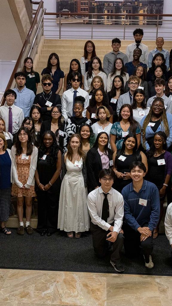 Photo: A group of Boston University Menino Scholars and Community Service Award recipients posing with BU President Melissa Gilliam