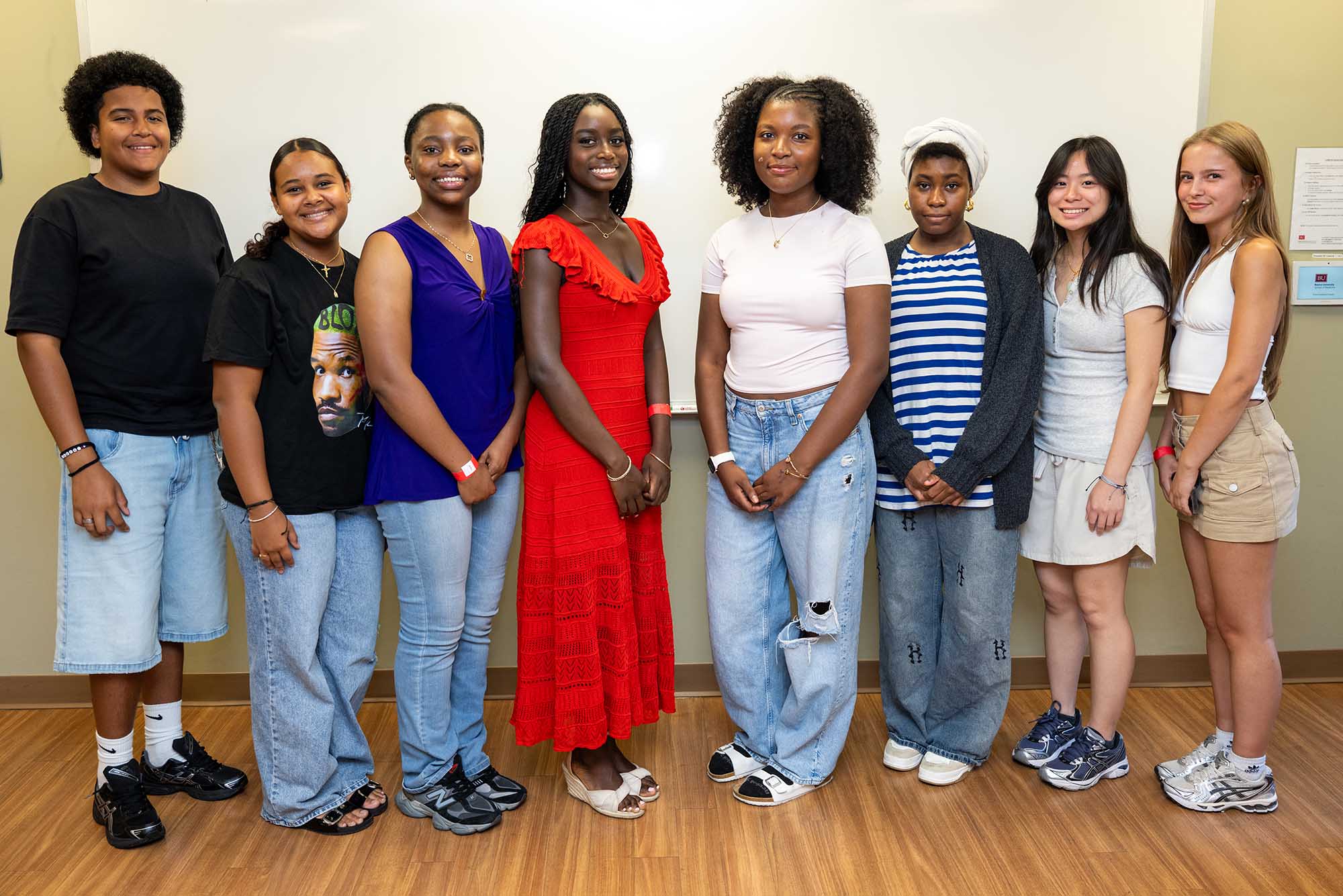 Photo: A group of young individuals who students presented their work at MED.