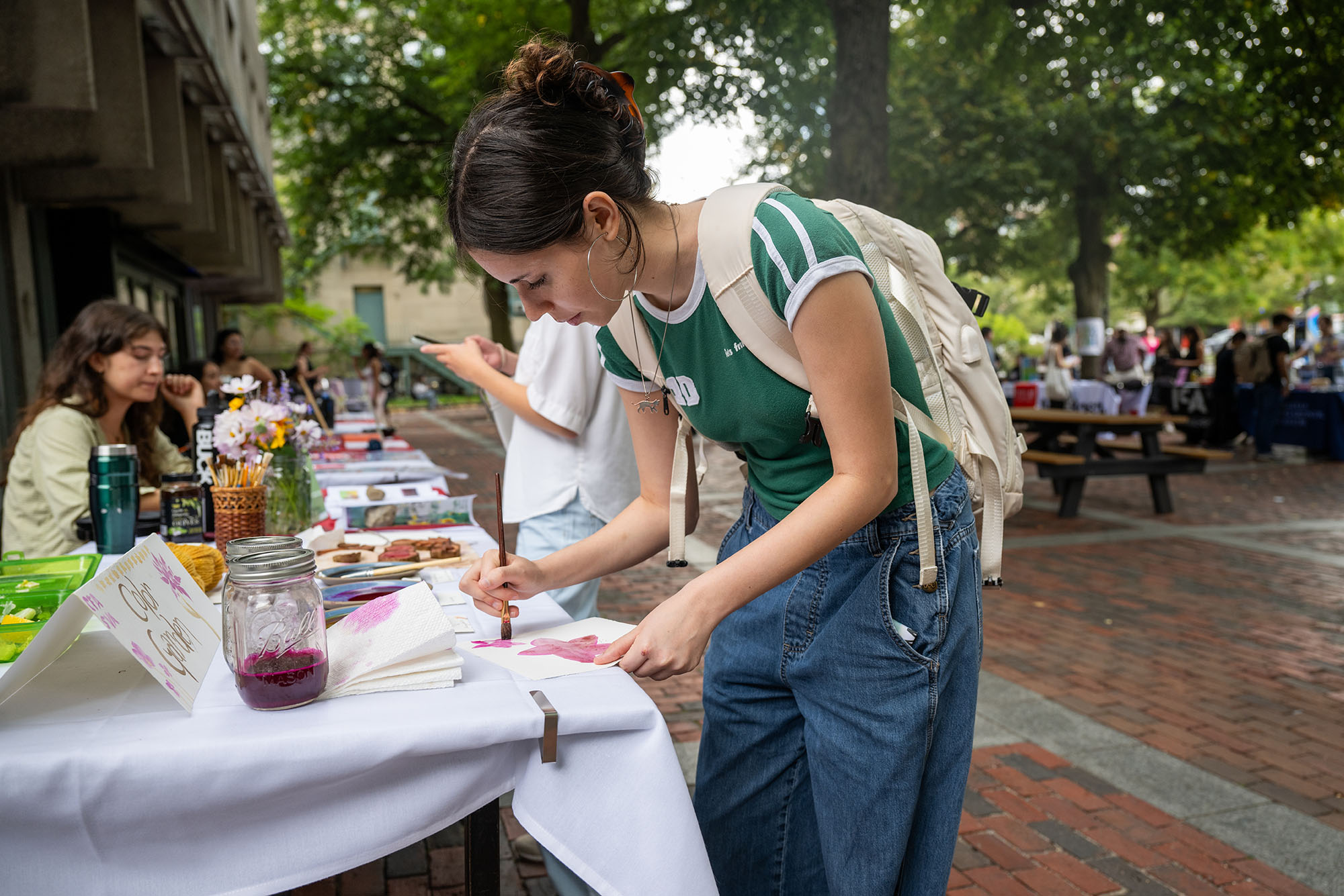 Photo: Student at a table during the Fall Arts Fair