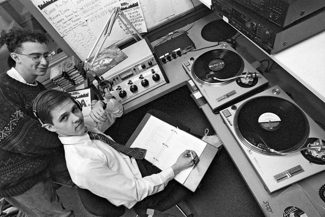 Photo: Students in front of vinyl at WTBU radio at Myles Standish Hall