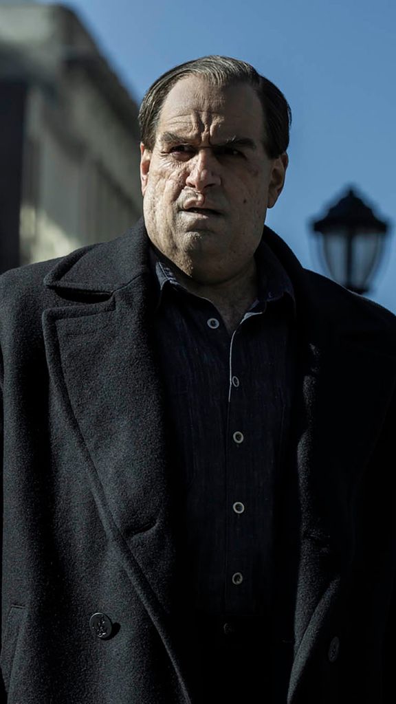 Photo: Oz, a character from Batman, portrayed by Colin Farrell, stares out onto the street ahead of him