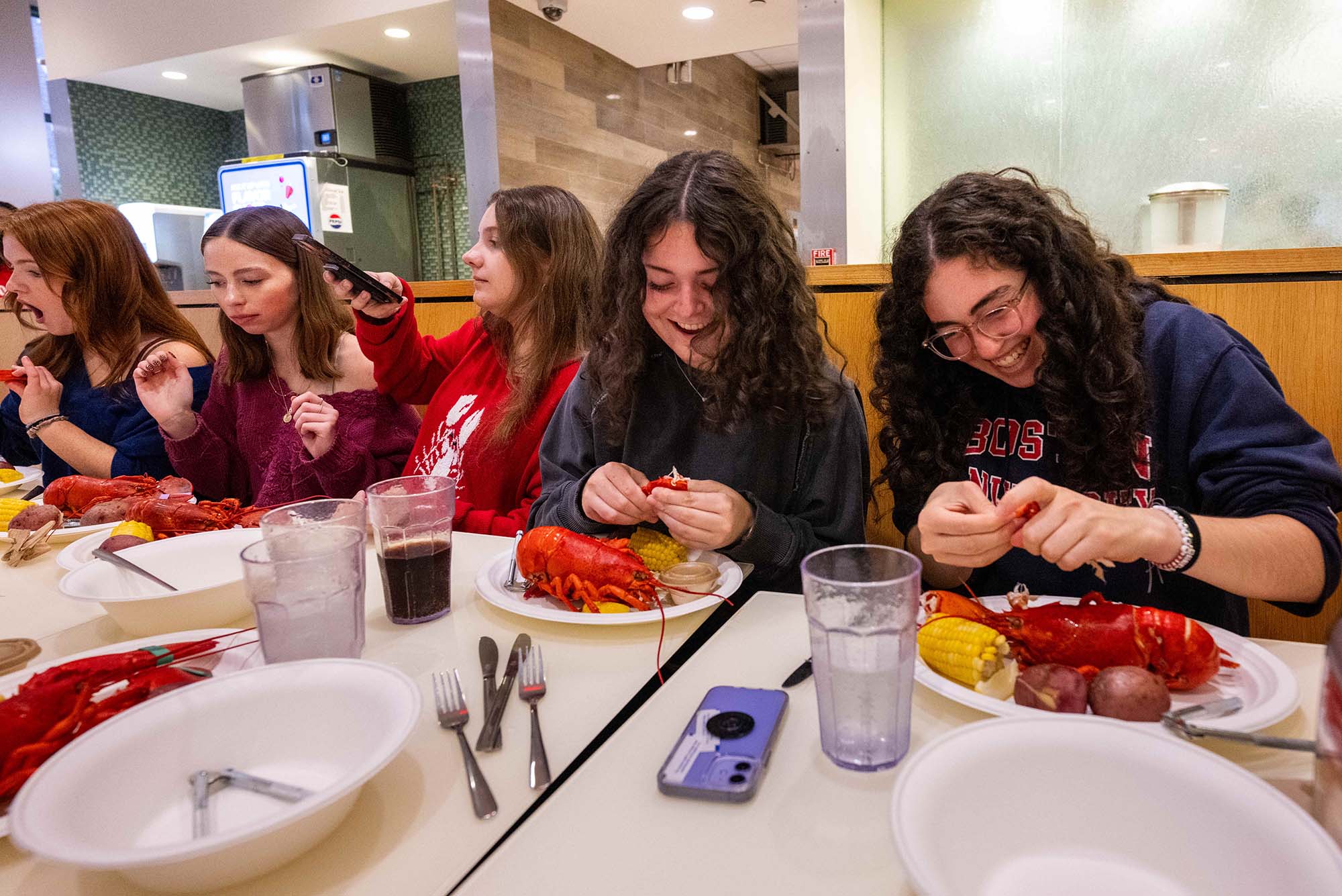 Photo: Students break down lobsters during Lobster Night 2025 at Boston University