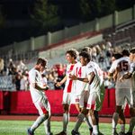 Photo: The BU Men's Soccer team celebrating on the field