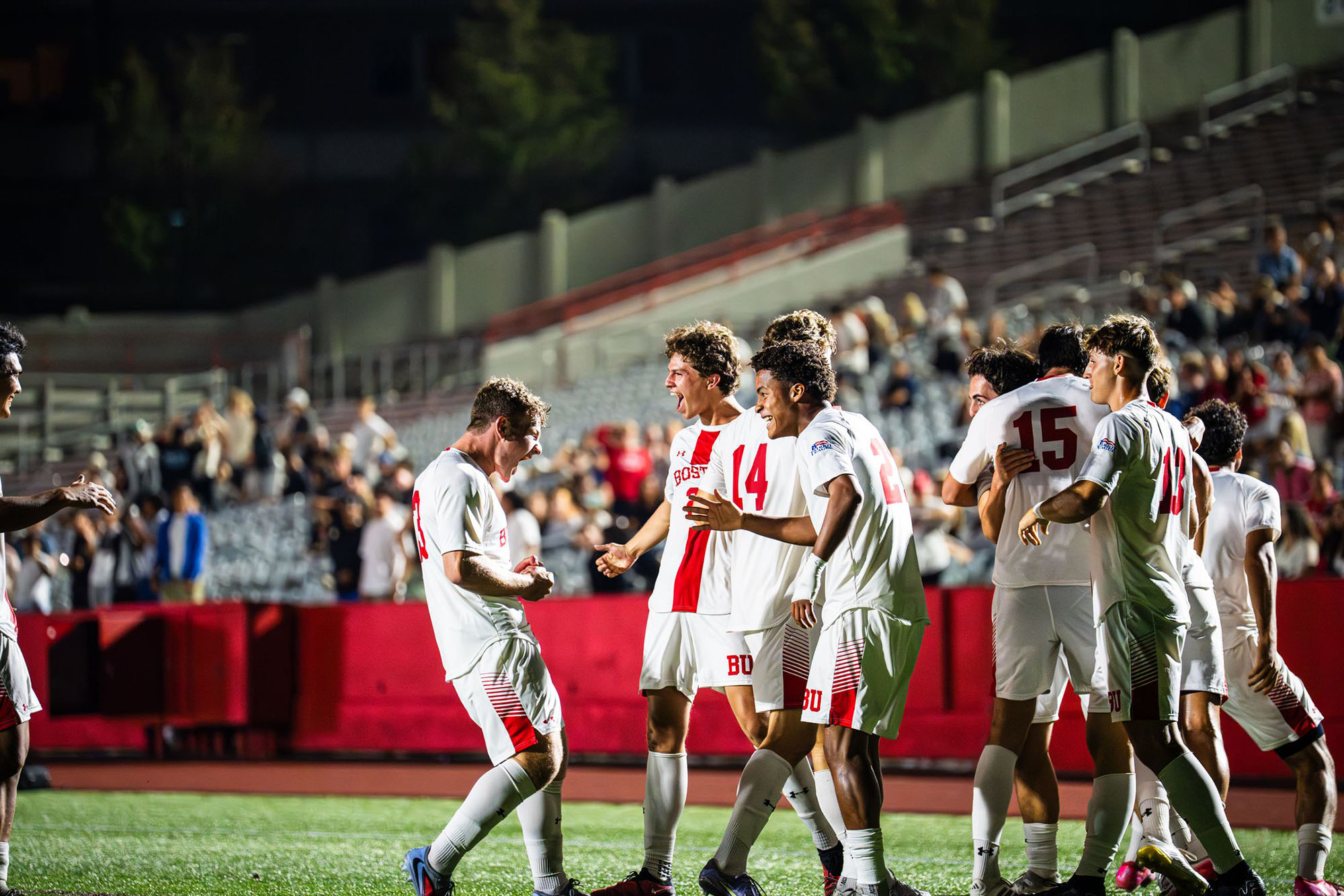 Photo: The BU Men's Soccer team celebrating on the field