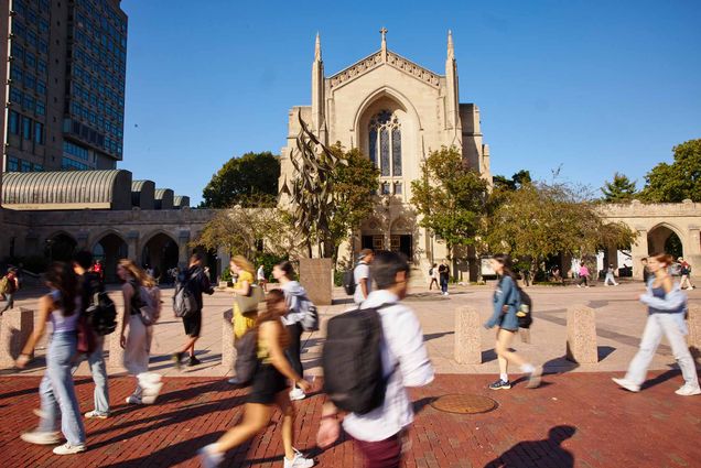 Photo: A campus shot with students mingling about at BU.