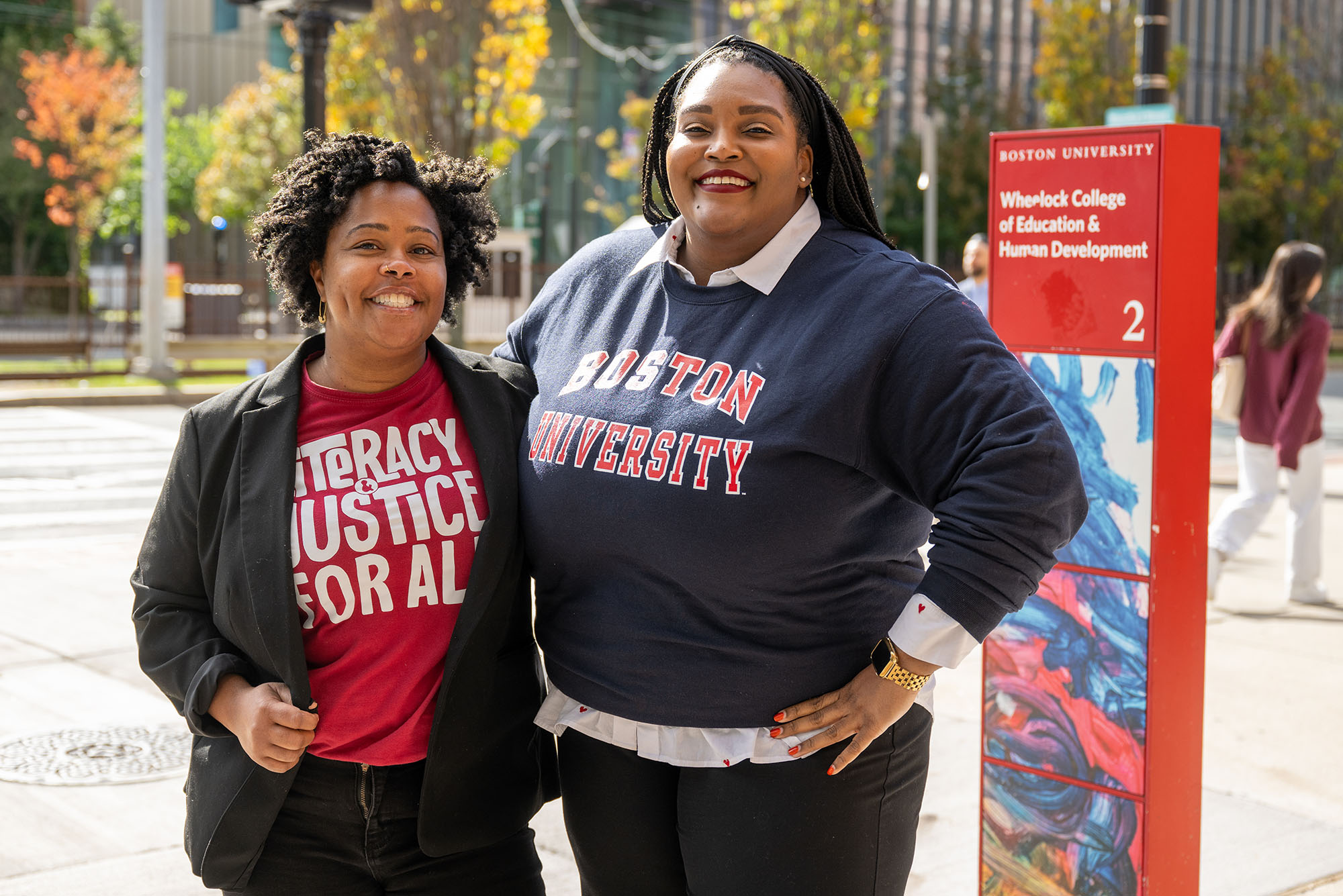 Photo: Two women smiling and posing on Commonwealth Avenue