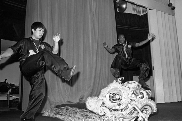 Photo: A black-and-white archive photo featuring dancers in front of a room