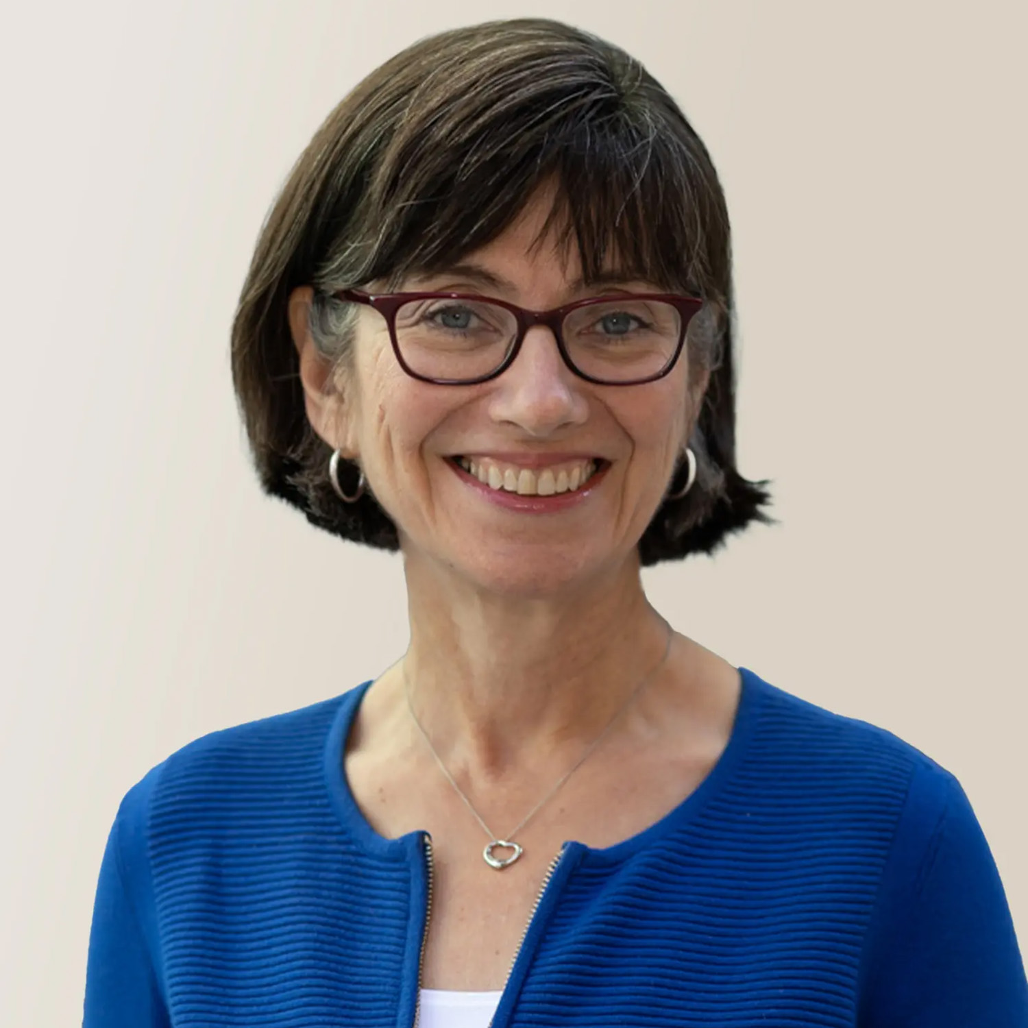Photo: A headshot of Barbara Bickart, a Questrom School of Business professor at Boston University. She has short, brown hair and is wearing a blue sweater and smiling