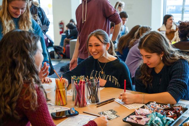 Photo: A group of young woman enjoying a BU writing event.