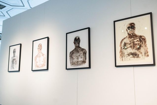 Photo: Five frames on a wall at an art gallery.