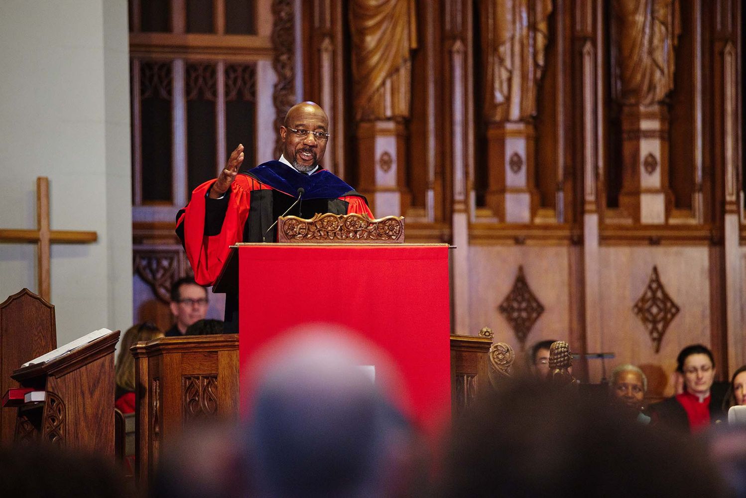 Photo: GA U.S. Senator Rev. Raphael Warnock preaches to a crowd at BU's Marsh Chapel's 75th anniversary.