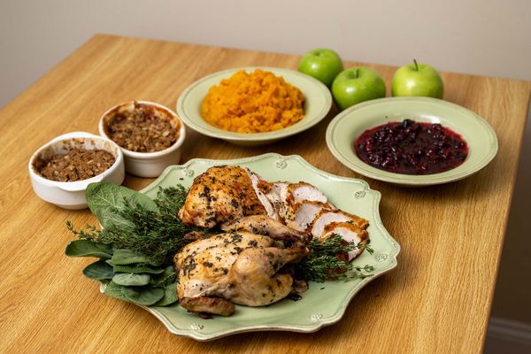 Photo: A spread of food on green dishware and a dorm-style table