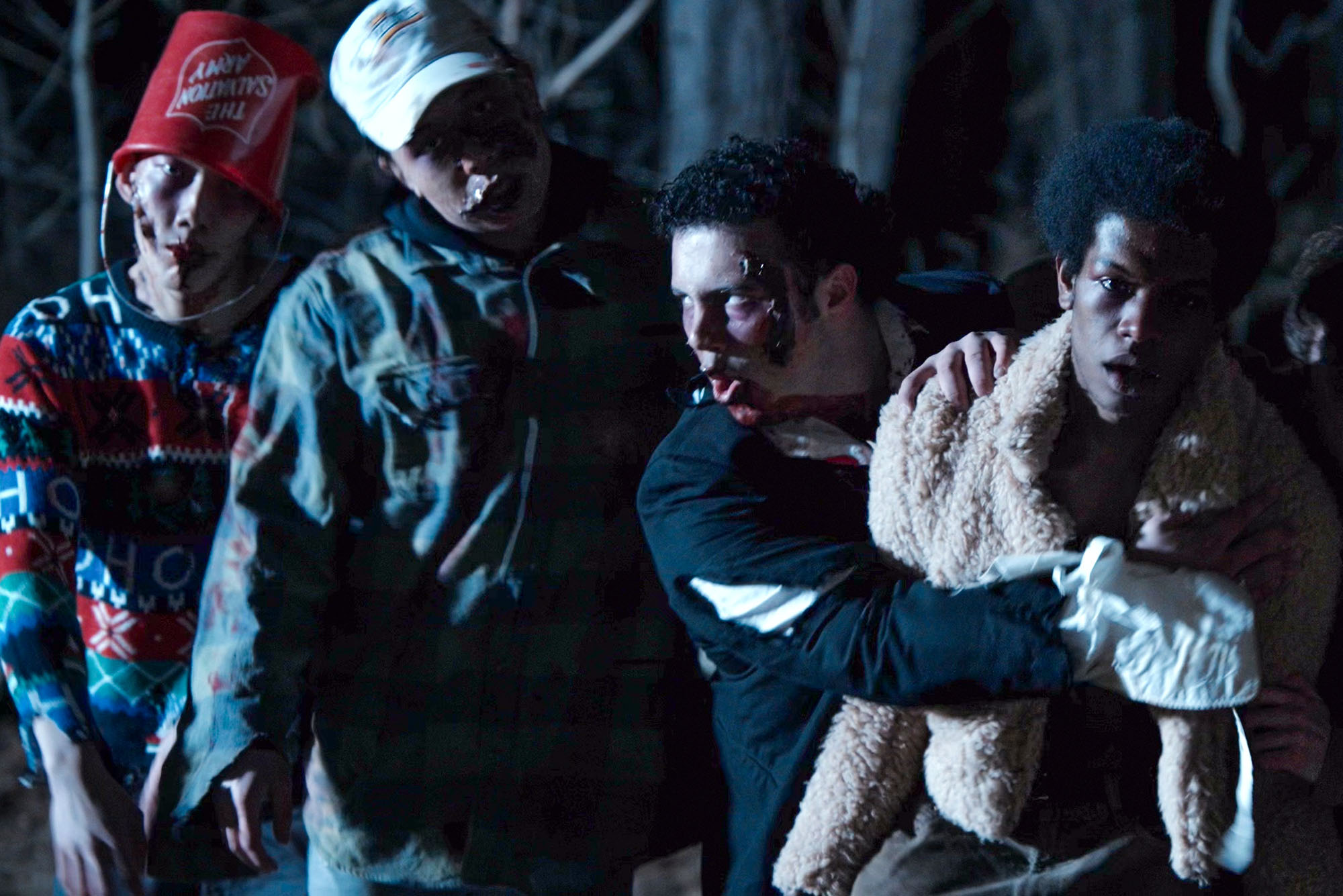 Photo: A still from a college a cappella group music video. The singers are dressed as zombies.