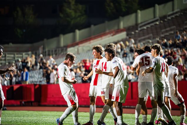Photo: The BU men's soccer team celebrating a win on the field