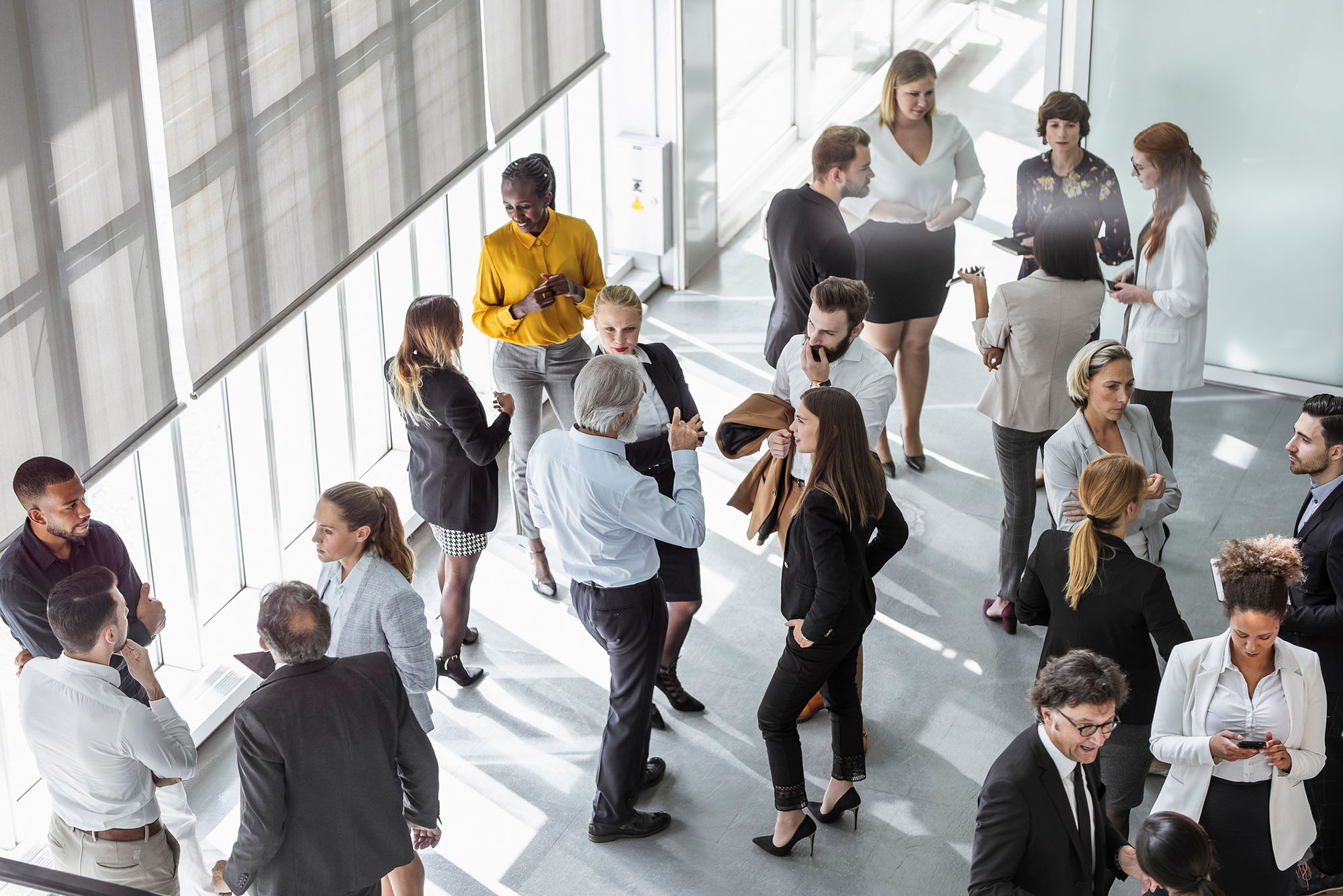 Photo: An aerial view of a room of people at a networking event