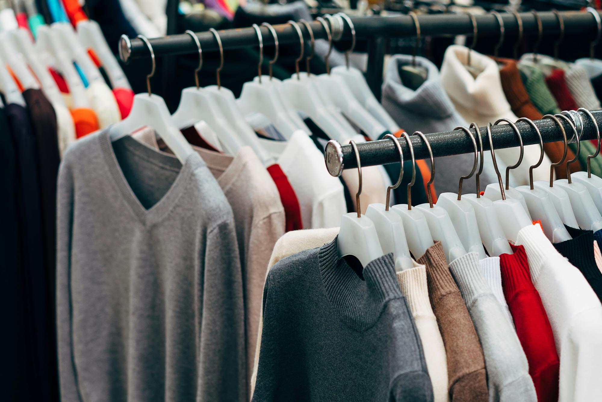 Photo: Racks of clothing at a thrift store.