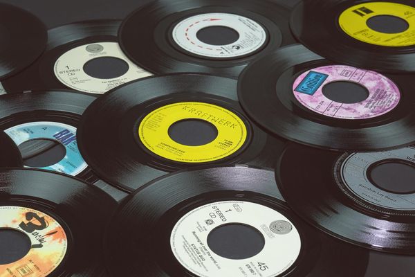 Photo: A stock photo of records piled on top of each other.