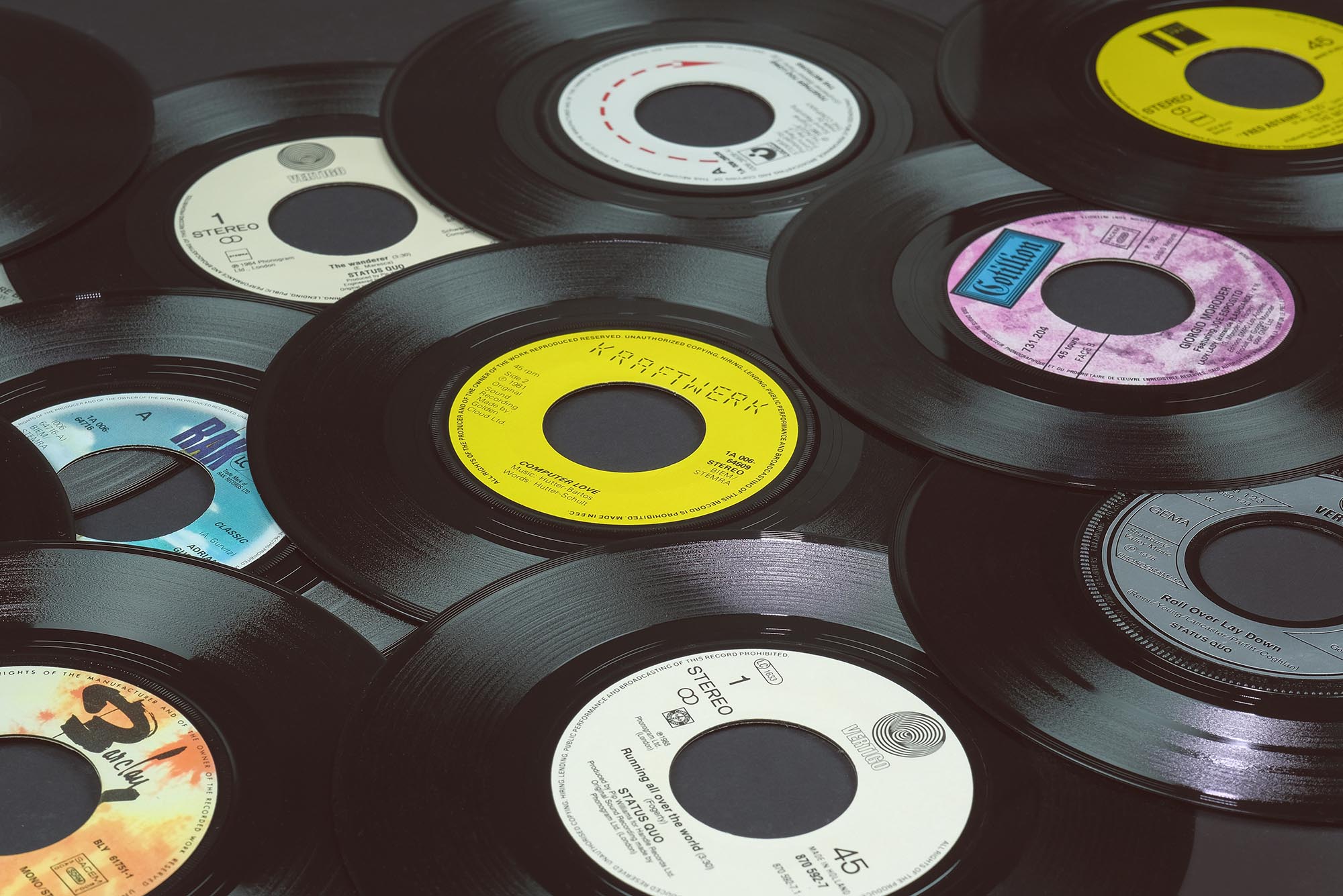 Photo: A stock photo of records piled on top of each other.