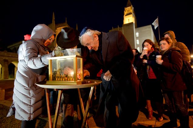 Photo: At Marsh Plaza, Elie Wiesel, right, assists Rabbi Joseph Polak, canter, with the Grand Menorah Lighting
