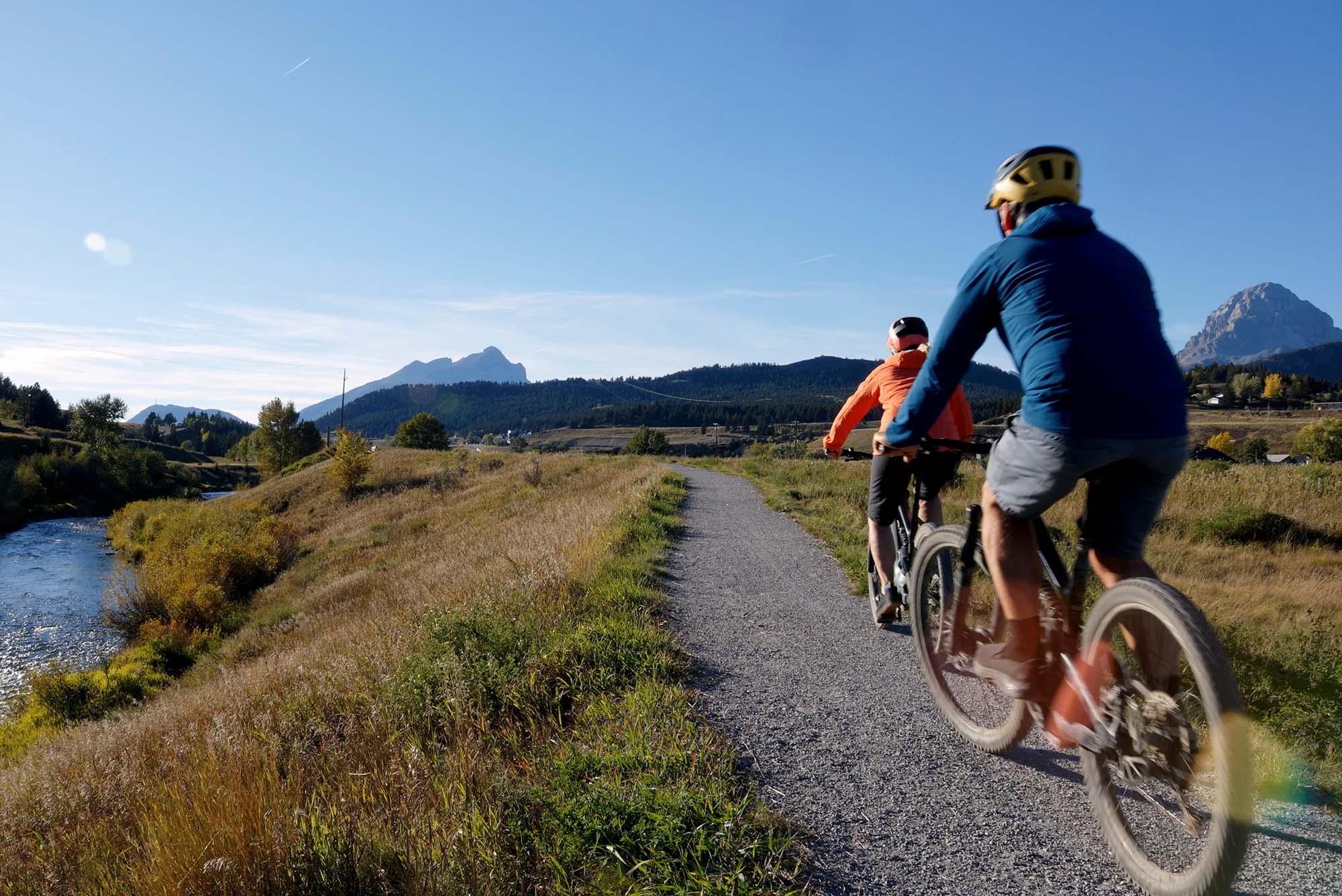 Photo: An older couple biking in nature