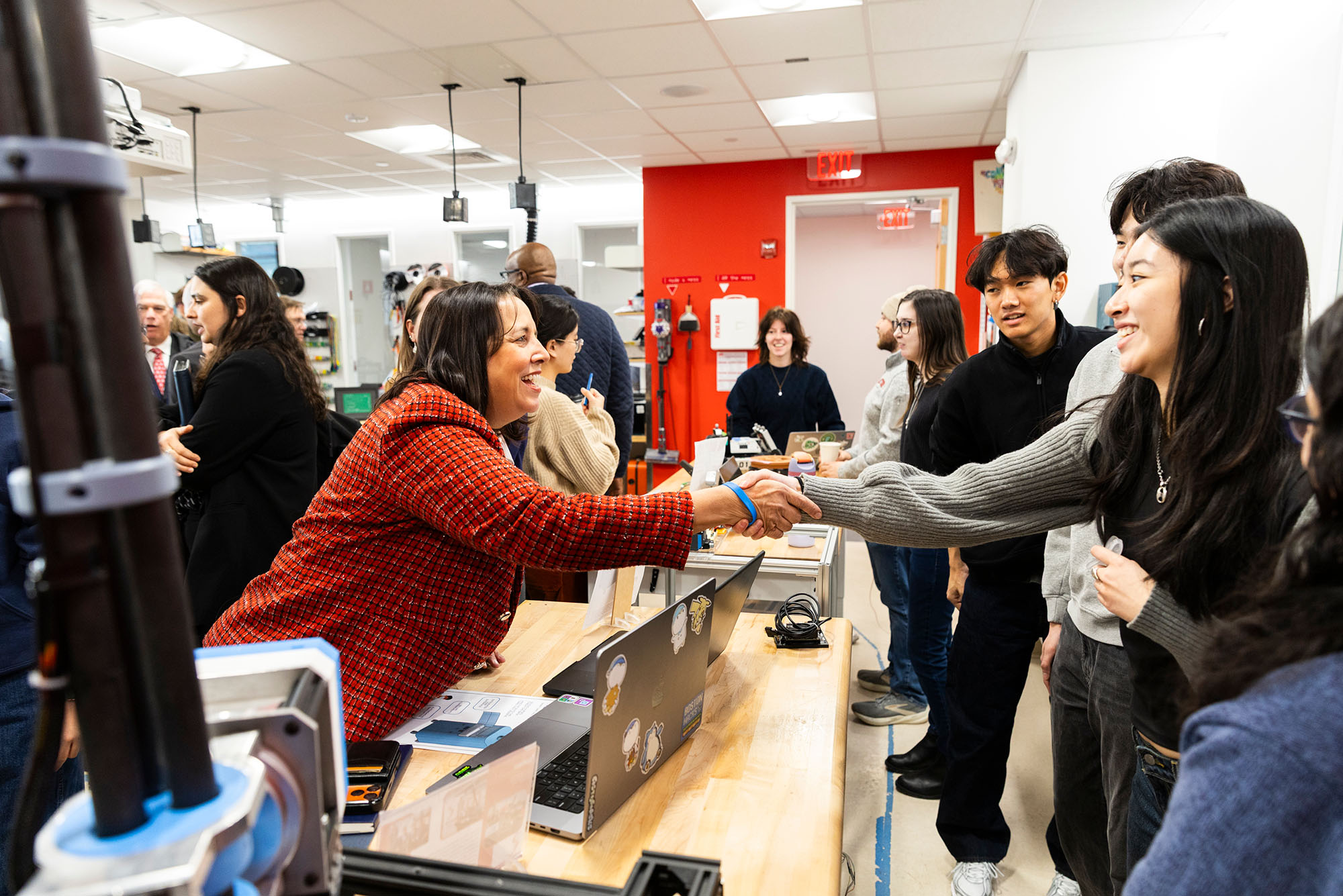Photo: Massachusetts Lt. Governor Kim Driscoll (left) shaking hands with Audrey Wang (ENG’26) at BU’s Robotics & Autonomous Systems Teaching and Innovation Center on February 5th.