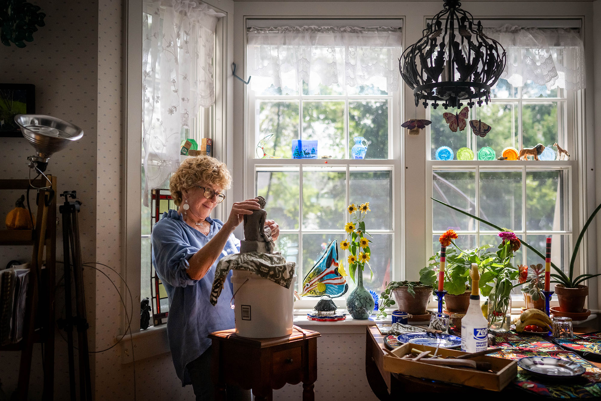 Photo: Sculptor Janice Corkin Rudolf in her studio working