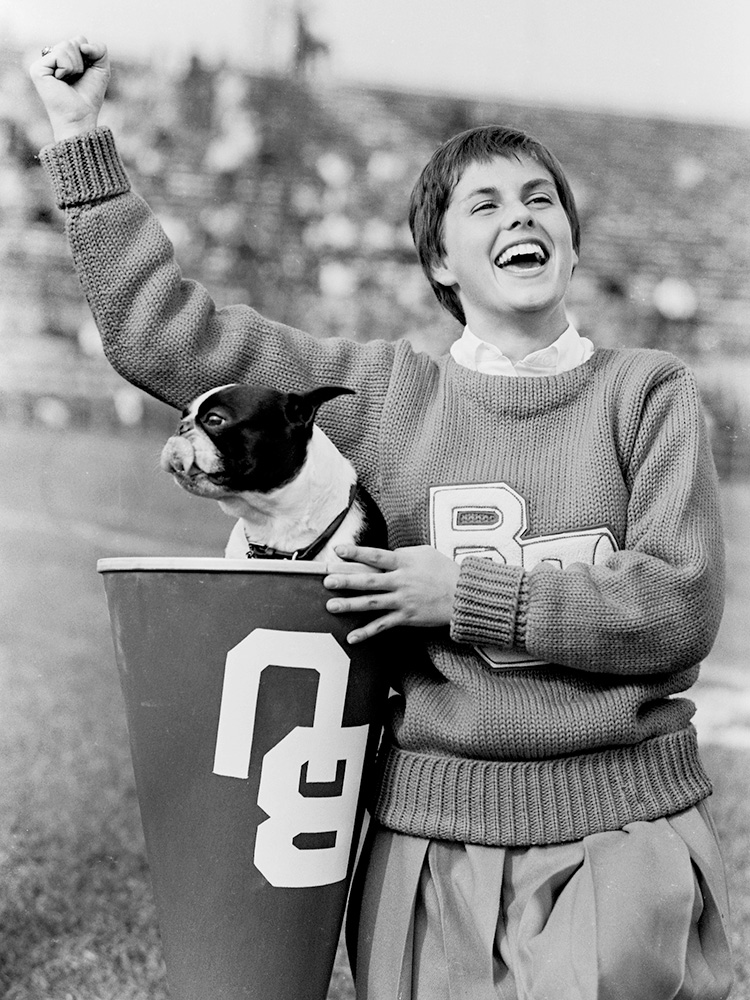 10/15/1960 -- Boston, Massachusetts Boston University Cheerleader Diane Etienne had an occupant in her megaphone during a game against George Washington University. Photo by Boston University Photography
