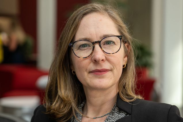 Photo: Julie Dahlstrom, winner of Boston University's Metcalf Cup and Prize, posing while wearing a blouse and black suit jacket